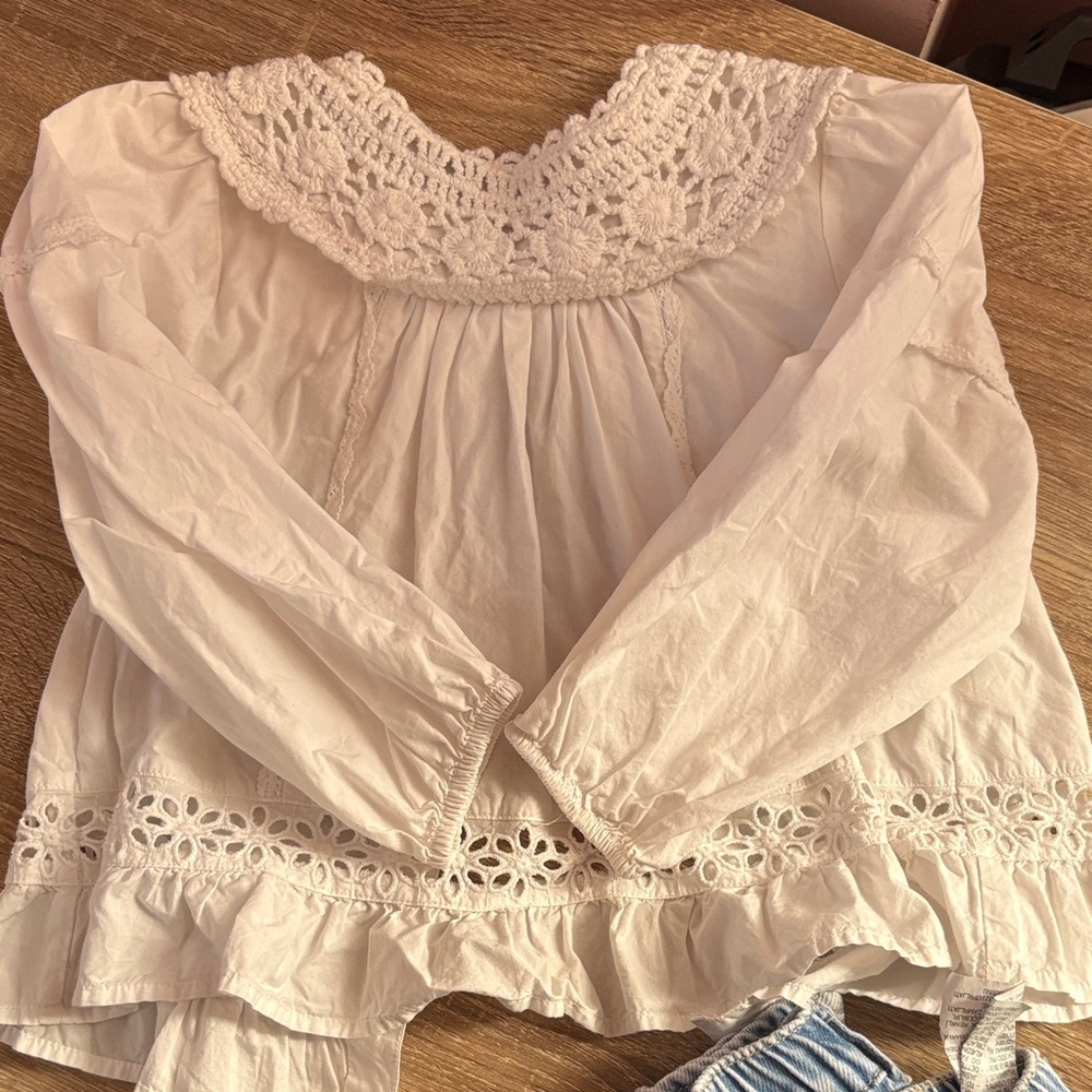 Zara White Crochet Long-Sleeve Blouse with ruffled jeans